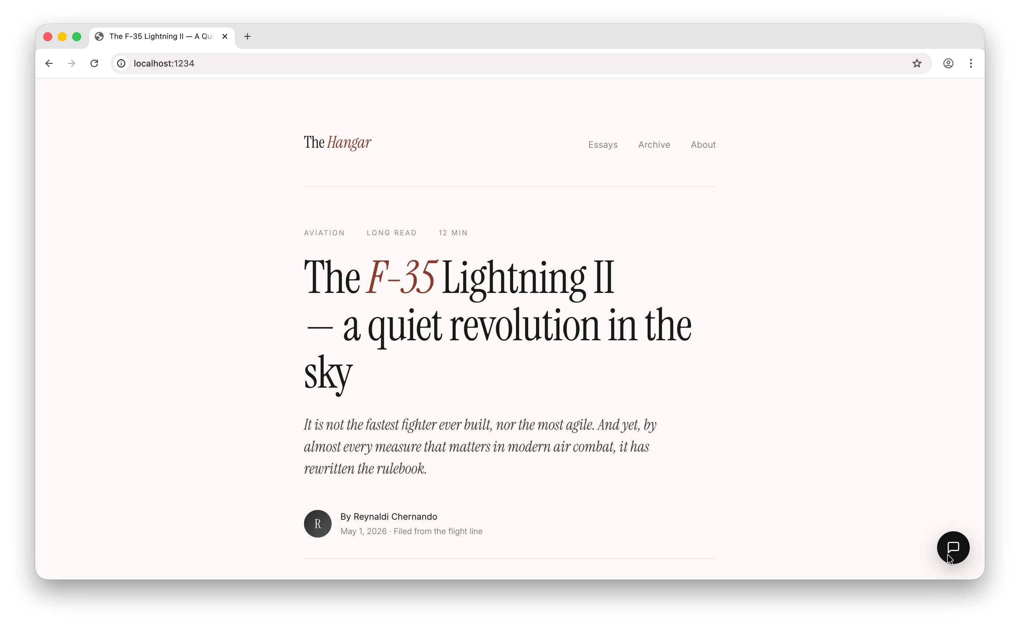 Floating chat button at the bottom right of the page